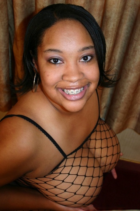 Ebony BBW takes a cumshot in her mouth after riding a brother's cock