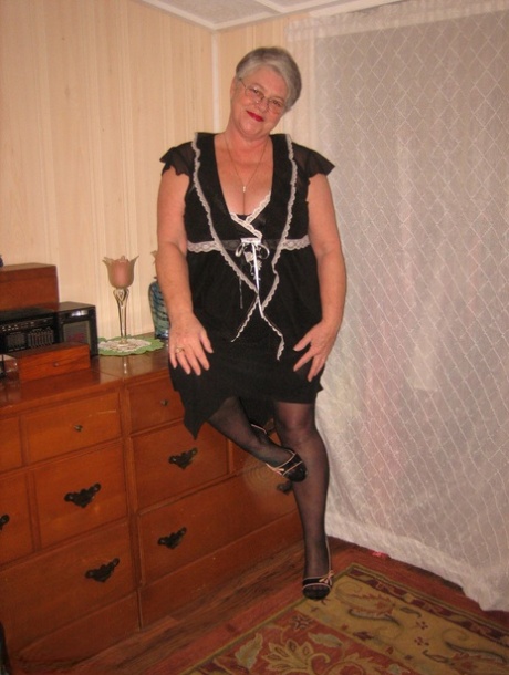 Overweight nan Girdle Goddess strips to her footwear in front of a dresser