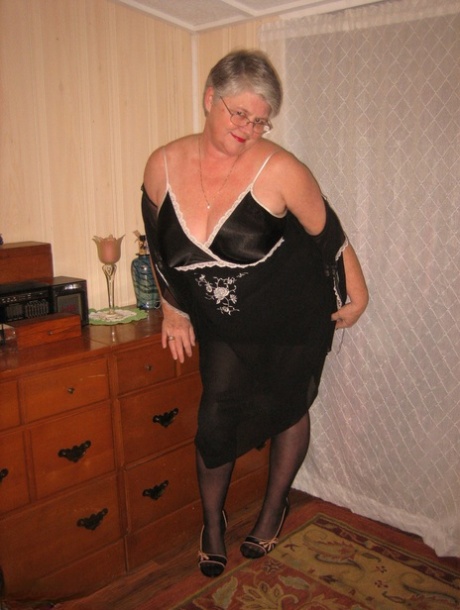 Overweight nan Girdle Goddess strips to her footwear in front of a dresser