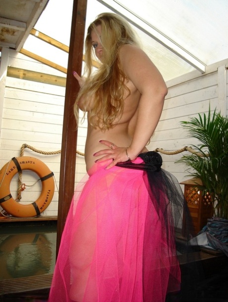 Blonde BBW Luscious Models humps a post while going nude in black boots