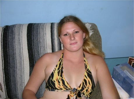 Strawberry blonde amateur with a shaved pussy sucks of a bald dude