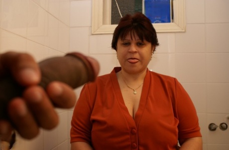 Fat short-haired GILF with big tits Martha gets her holes stuffed after peeing