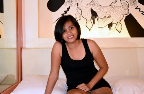 Amateur Asian girl shows her bubble butt and flaunts her shaved vagina