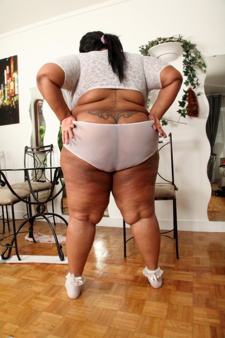Ebony BBW Cotton Candi lets out her monster juggs and plays with them