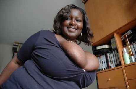 Ebony BBW Mariana Kodjo unleashing her massive tits and playing with them