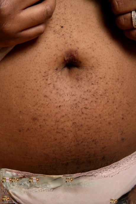 Ebony fatty Misty unleashes her big tits and spreads her furry cunt