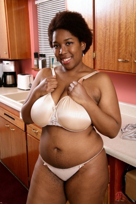 Ebony fatty Misty unleashes her big tits and spreads her furry cunt