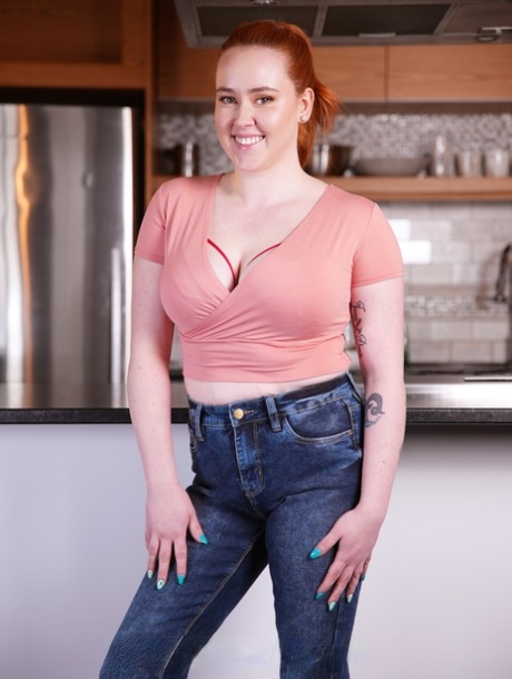 Chubby redheaded teen Rose Glitch strips and shows her big fat booty
