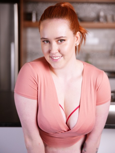 Chubby redheaded teen Rose Glitch strips and shows her big fat booty