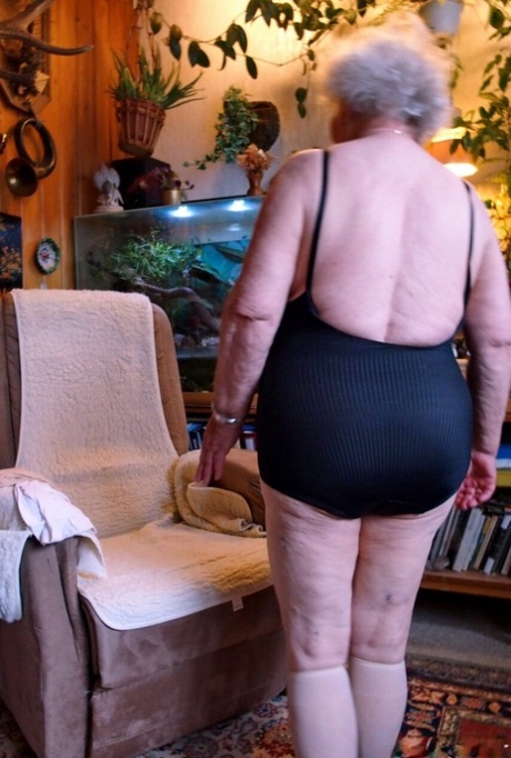Lonely granny Galfira exposes her big saggy tits while changing in a solo