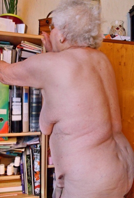 Lonely granny Galfira exposes her big saggy tits while changing in a solo